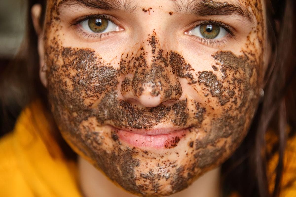 Face with rejuvenating coffee mask applied.