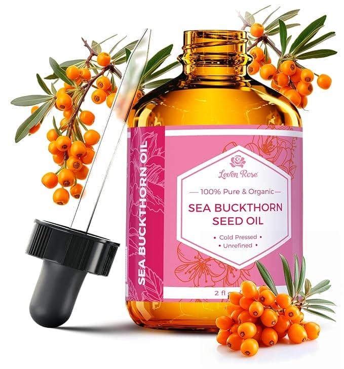 Sea buckthorn seed oil bottle and berries.