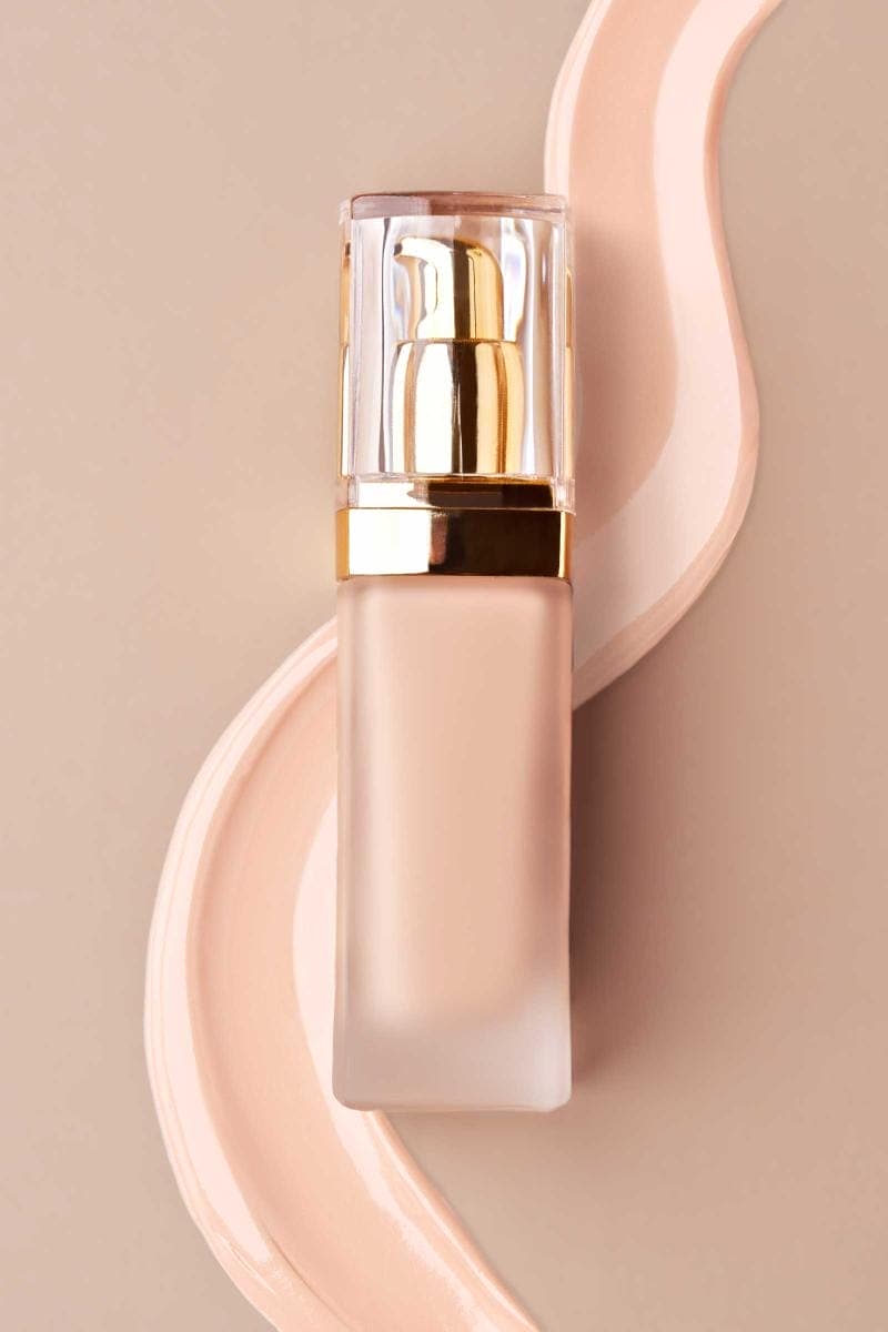 Luxury foundation bottle on beige background